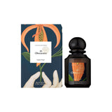 Flacon et boîte de parfum TIARA L'Artisan Parfumeur 25 Obscuratio avec illustration botanique sur fond bleu foncé